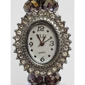 YLQ Women's dress watch. Beaded band with jeweled bevel